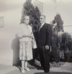 Archival photo of a couple outside their house