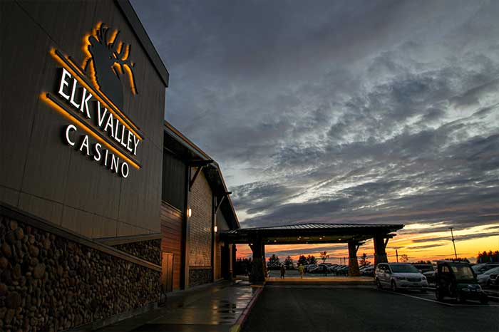 Elk Valley Casino set against a dramatic sunset
